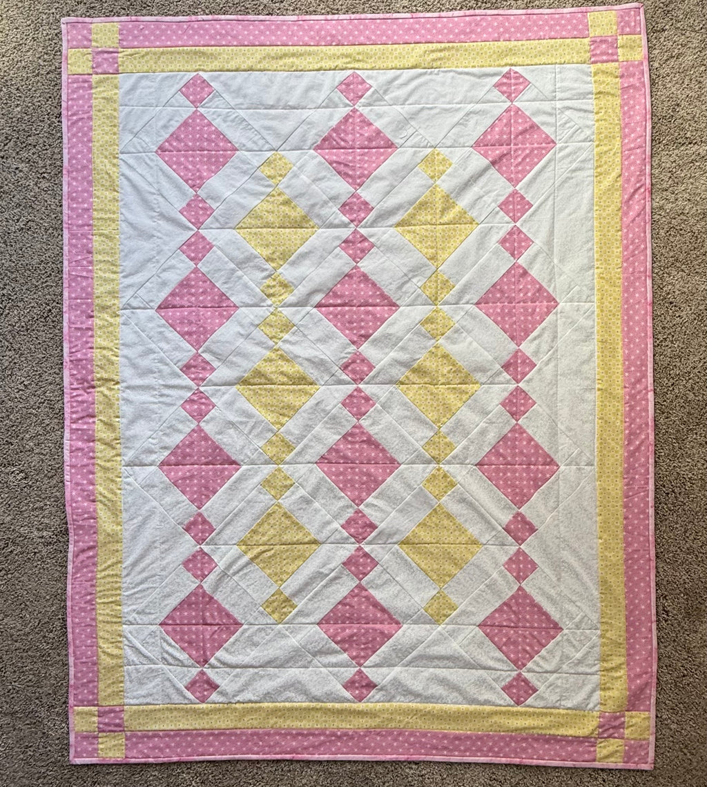 Handmade pink and yellow baby quilt in soft cotton, perfect baby gift, by Oak & Thread Quilts