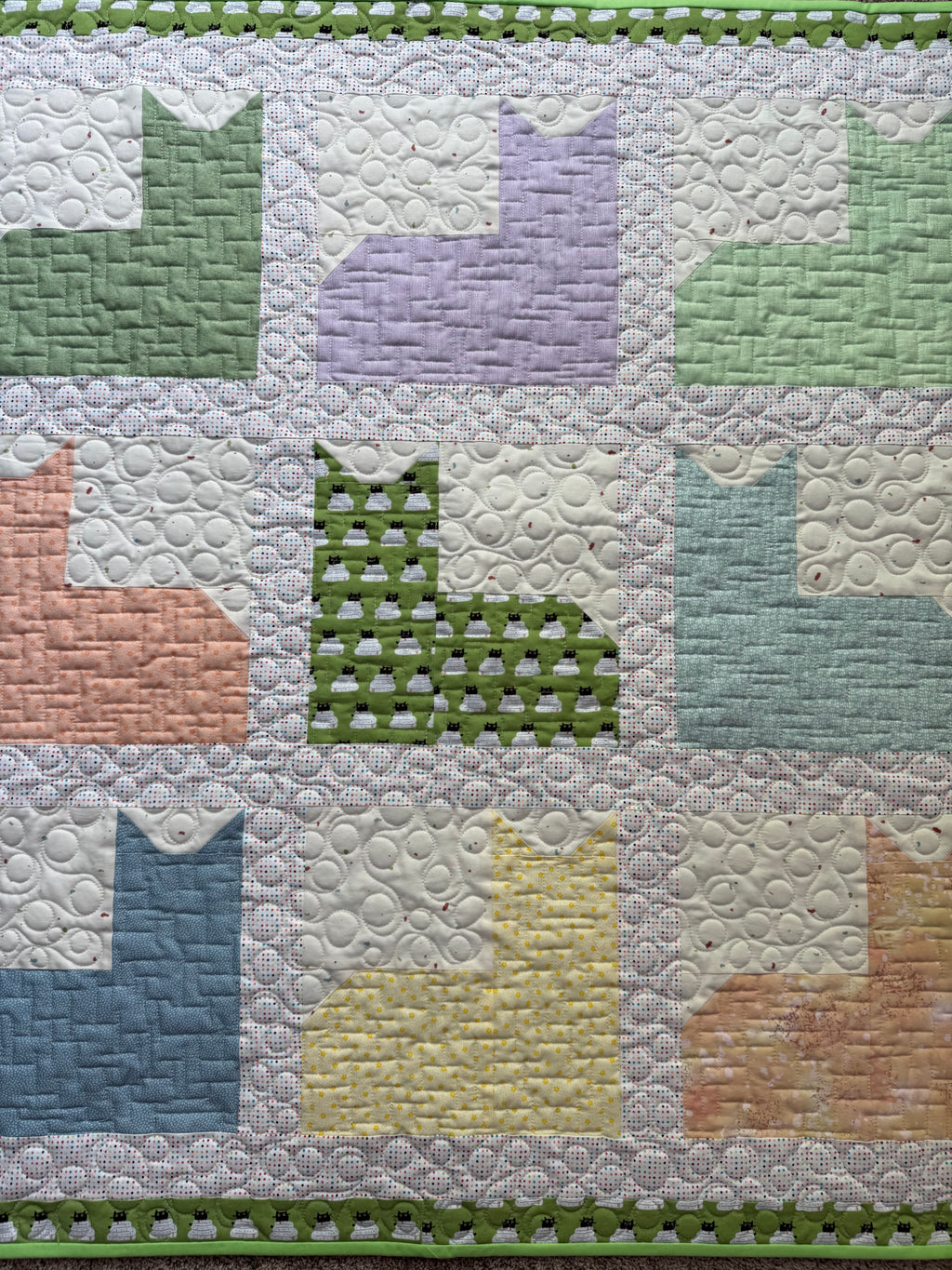 Close up of cats showing colors and quilting