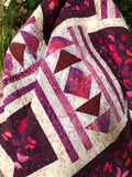Handmade batik quilt in pink and white with butterflies