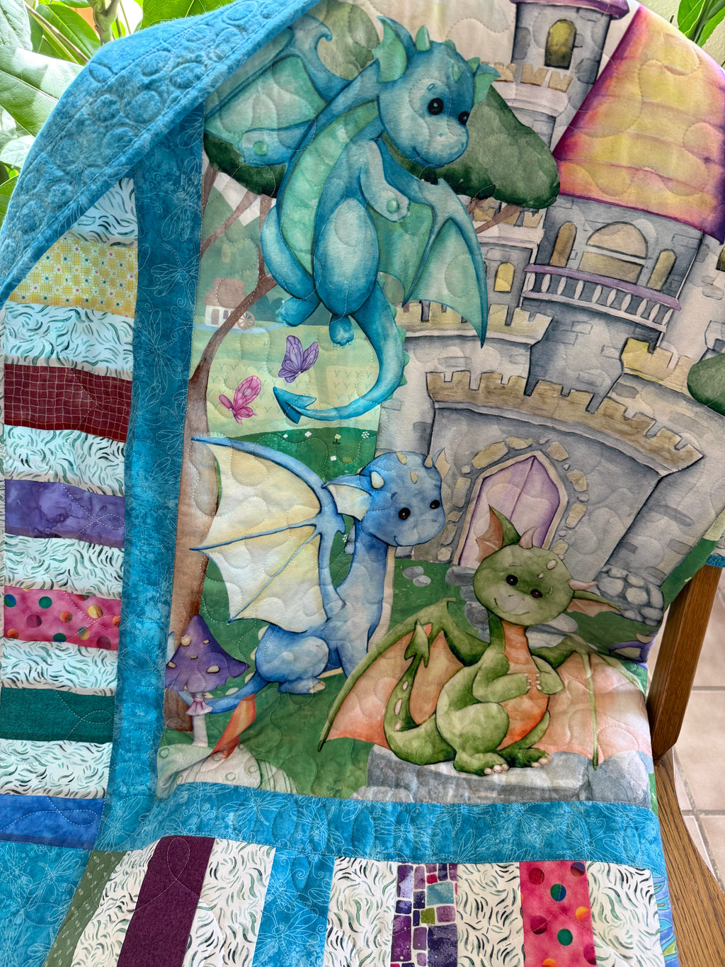 Handmade colorful dragon quilt for nursery
