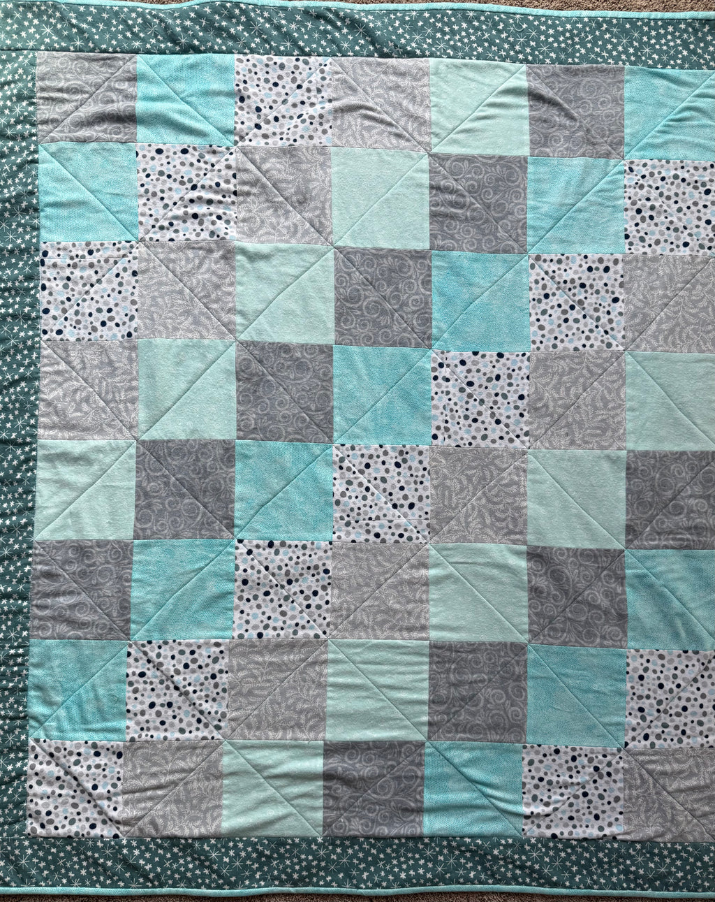 Handmade flannel scrap quilt in mixed prints, cozy and colorful, by Oak & Thread Quilts