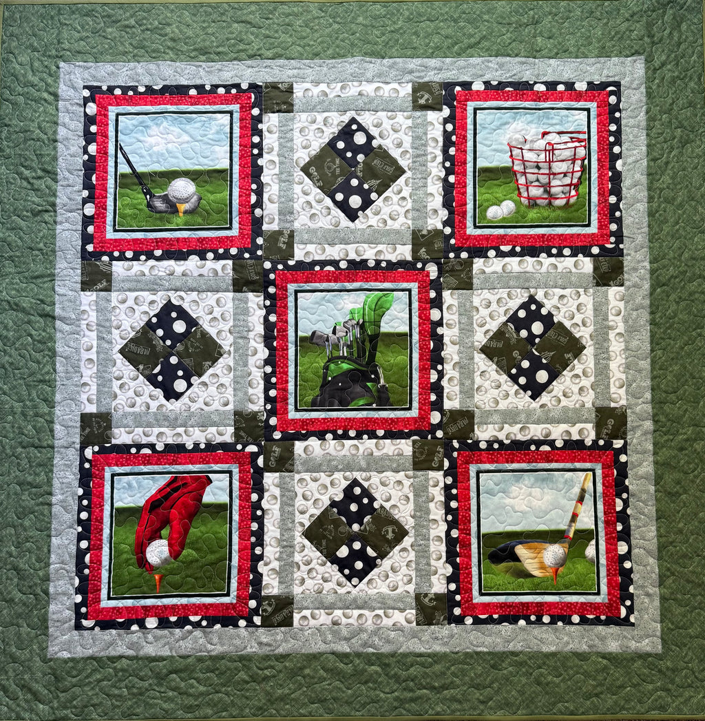 Close-up of golf-themed fabric squares in handmade lap quilt