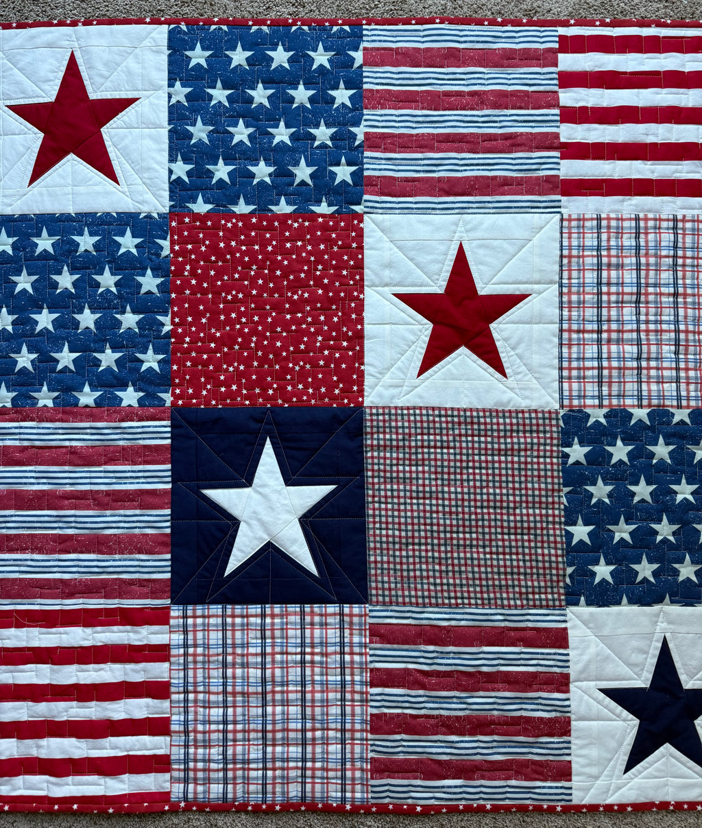 Red, white and blue Stars and Stripes quilt.