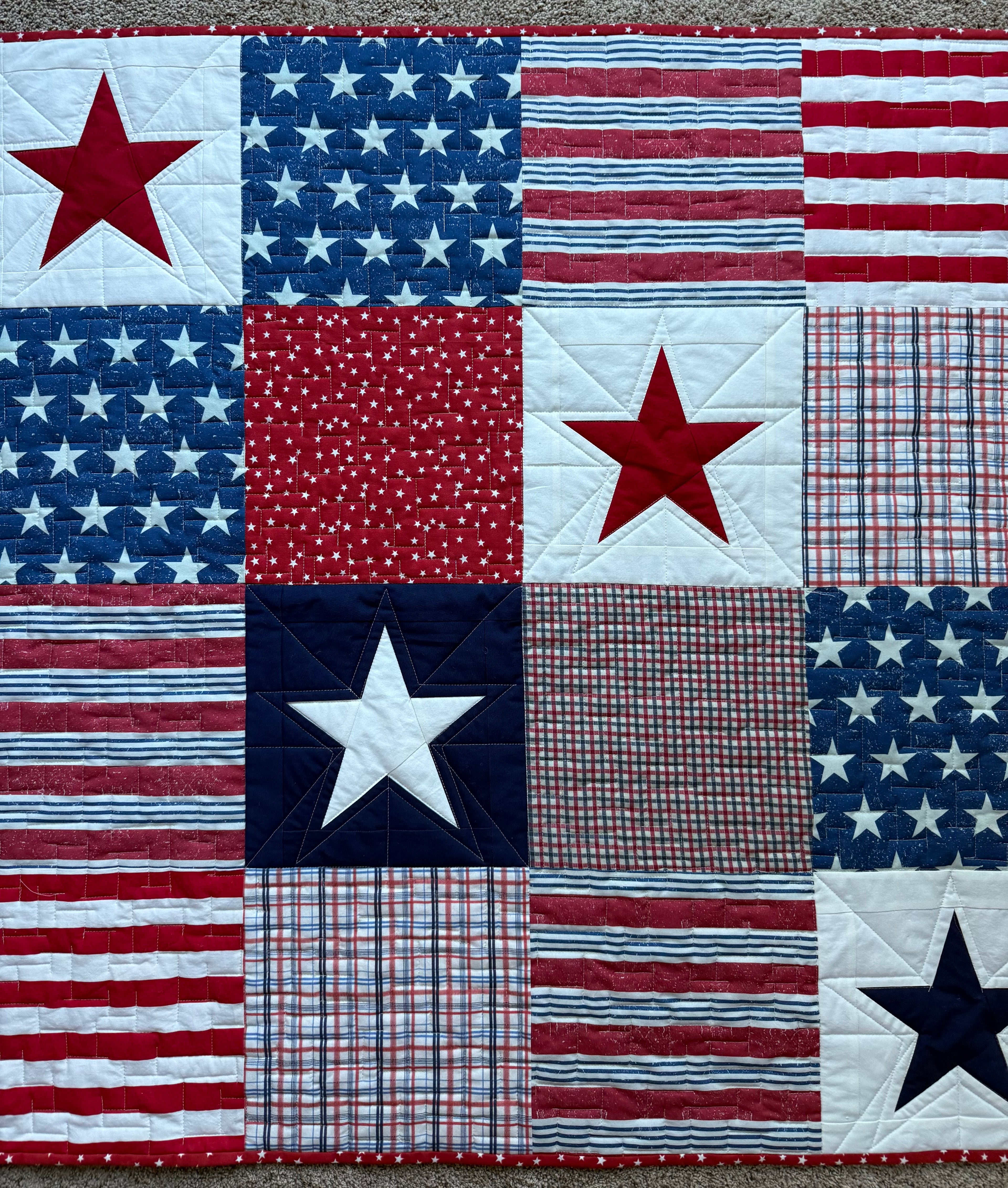 Red, white and blue Stars and Stripes quilt.