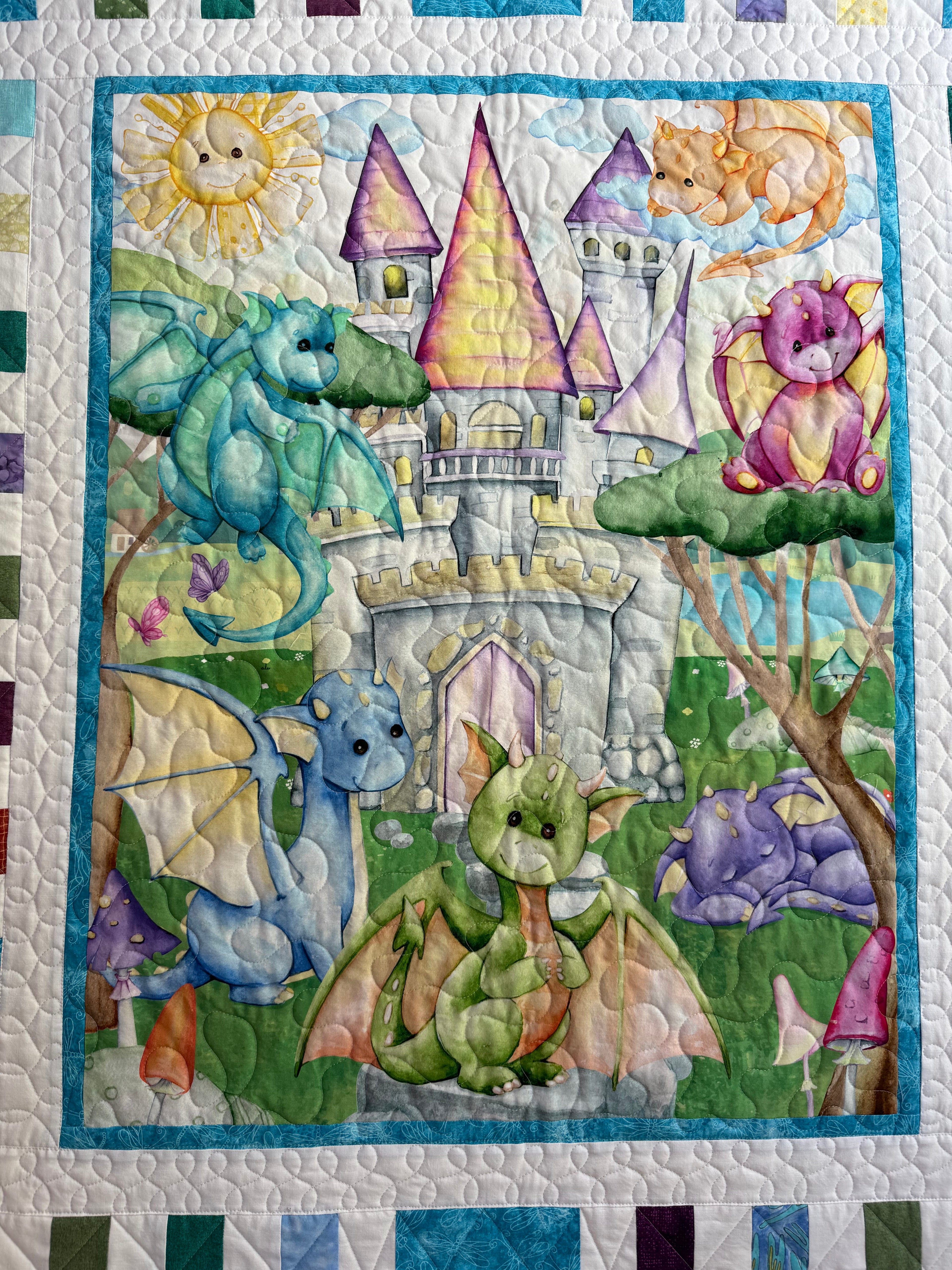 Handmade baby dragon quilt with colorful dragon design, soft cotton fabric, made by Oak & Thread Quilts