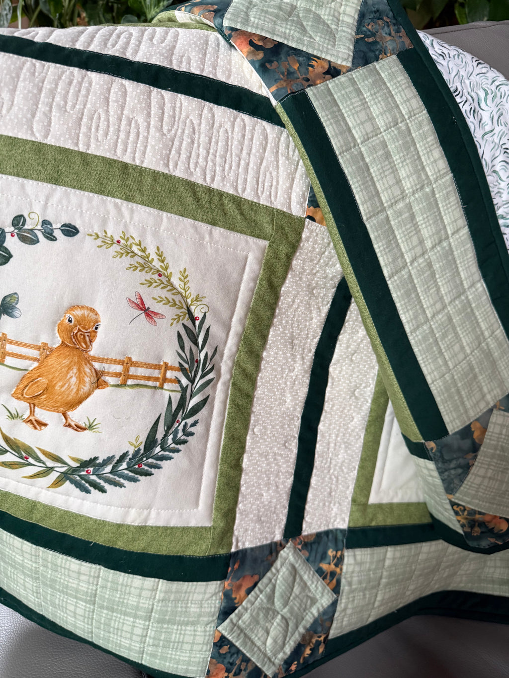 Close up of farm animal quilt with duckling