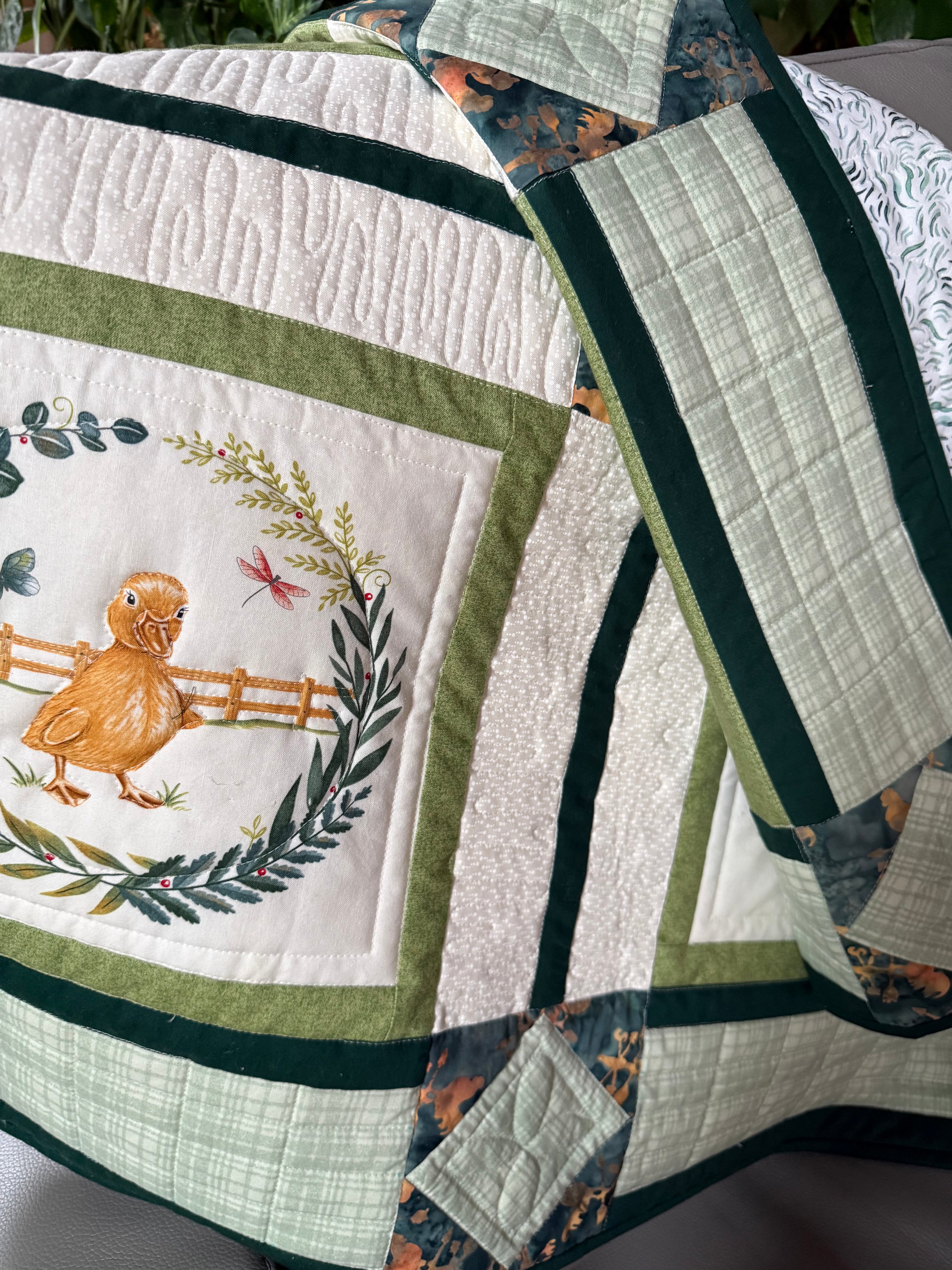  Close up of farm animal quilt with duckling