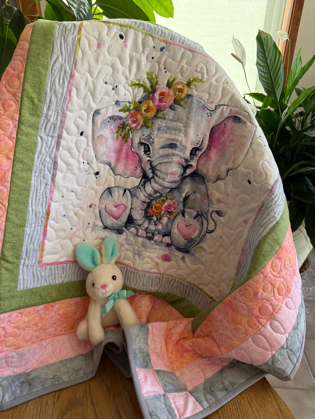 Handmade baby quilt with cute elephant in green, pink and gray fabrics