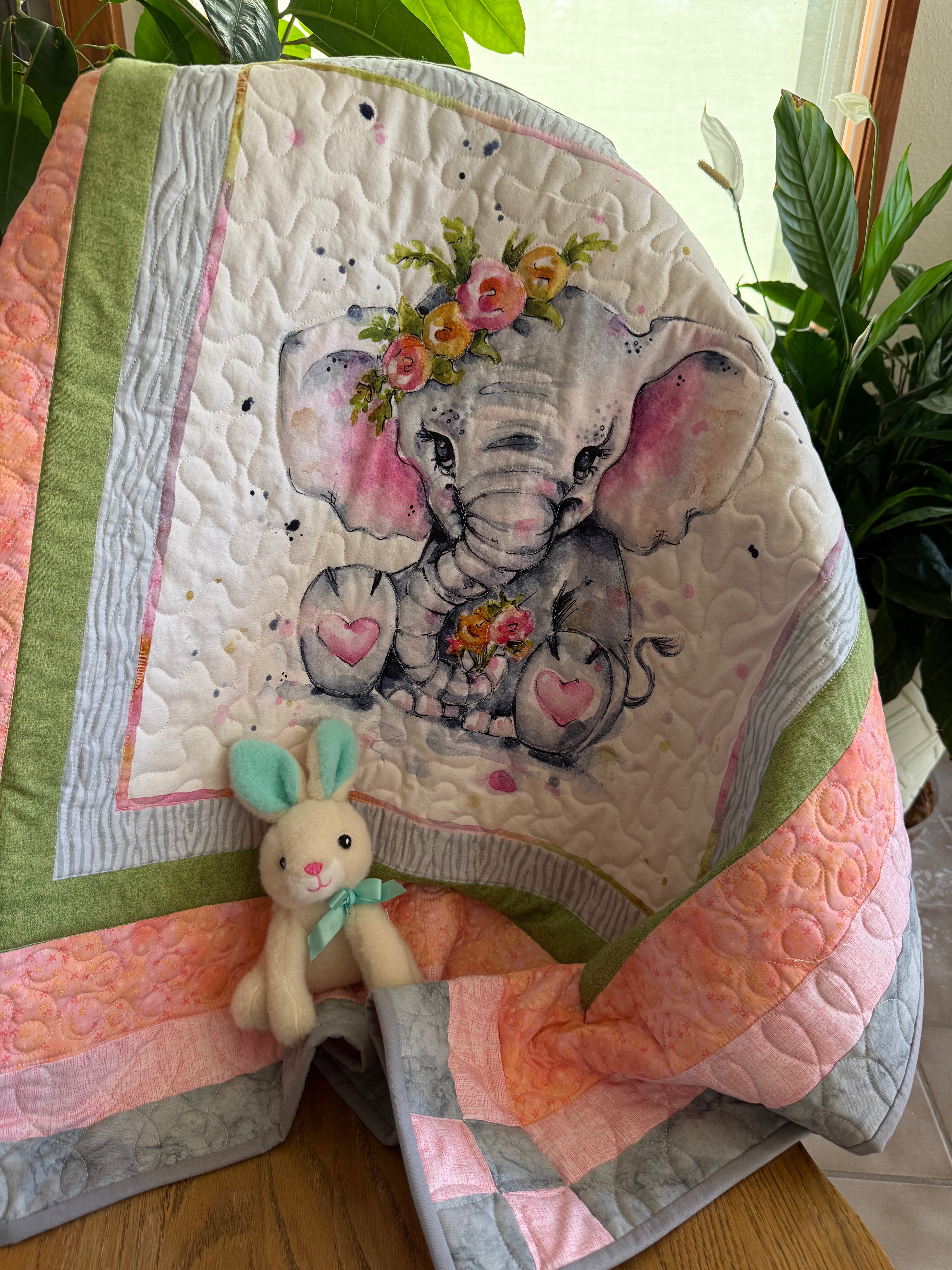 Handmade baby quilt with cute elephant in green, pink and gray fabrics