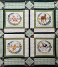 Handmade farm animal quilt with duckling and calf blocks