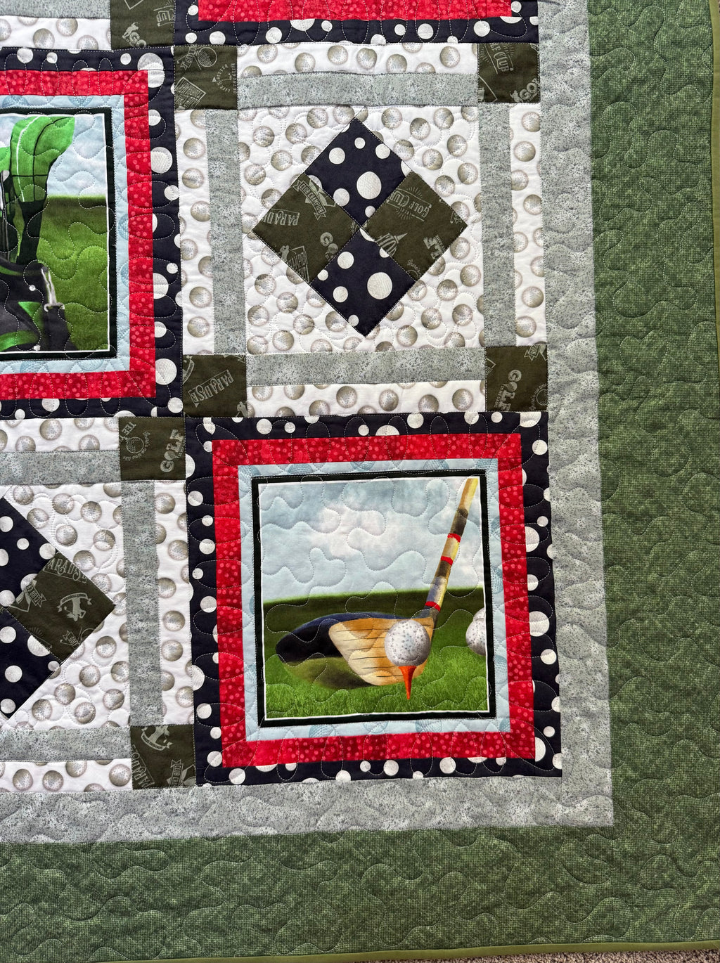 Detail shot of golf motif fabric in handmade patchwork quilt"