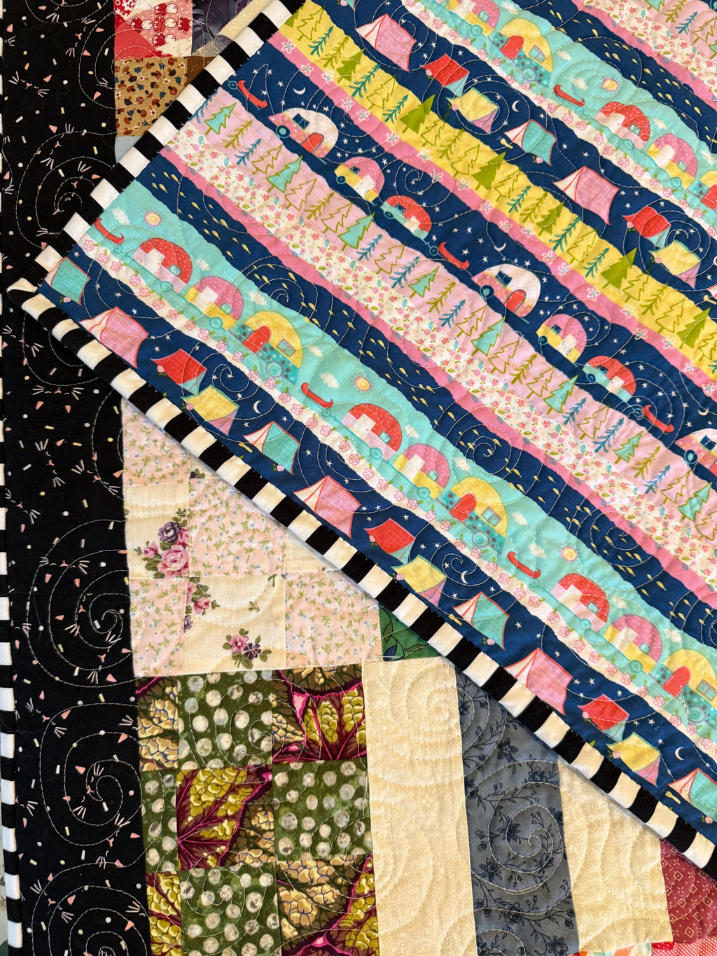 Bohemian scrap quilt folded to show texture and backing