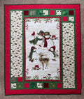 Handmade winter quilt featuring snowmen and forest animals