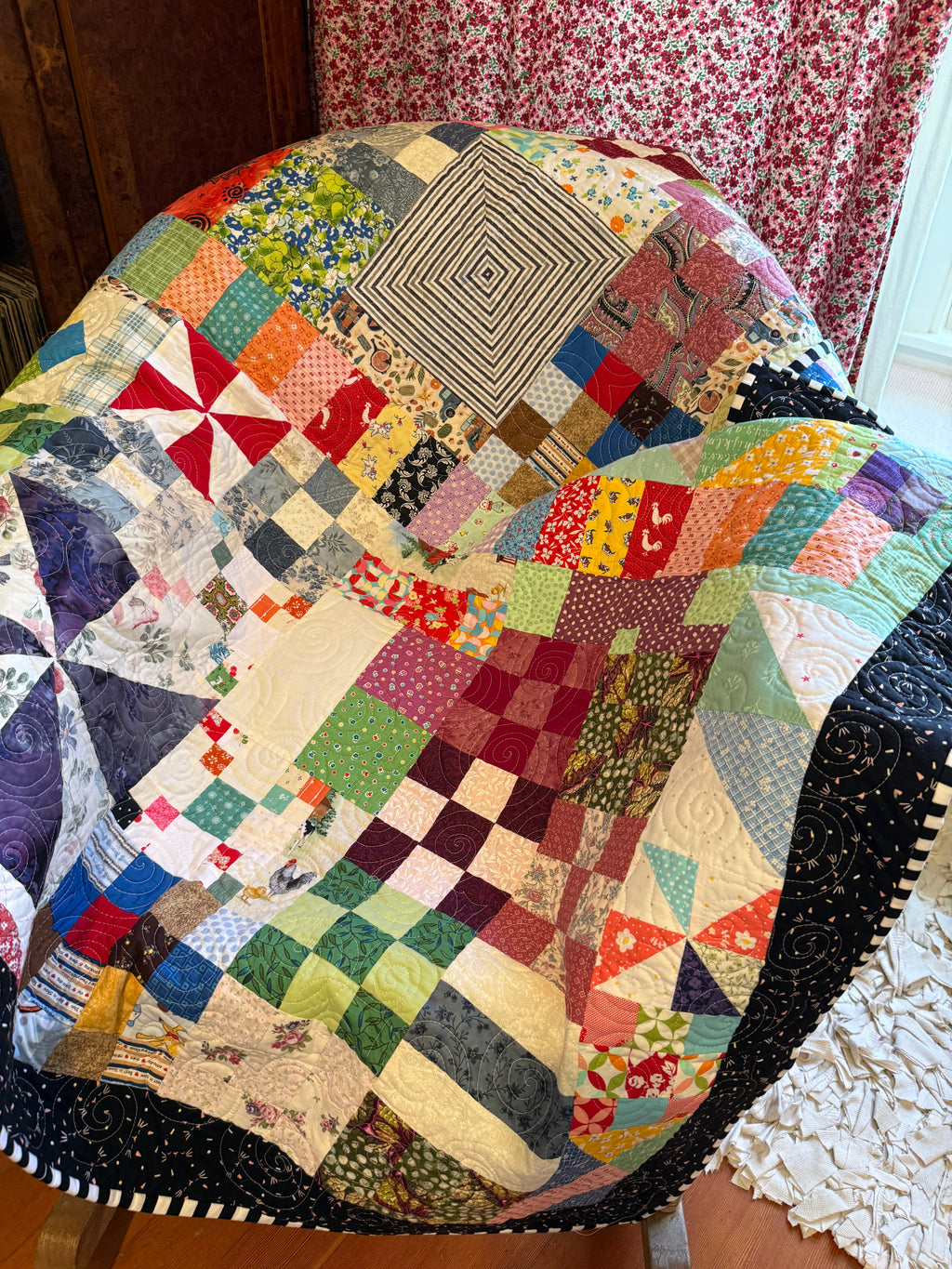 Bohemian scrap quilt folded to show texture and backing