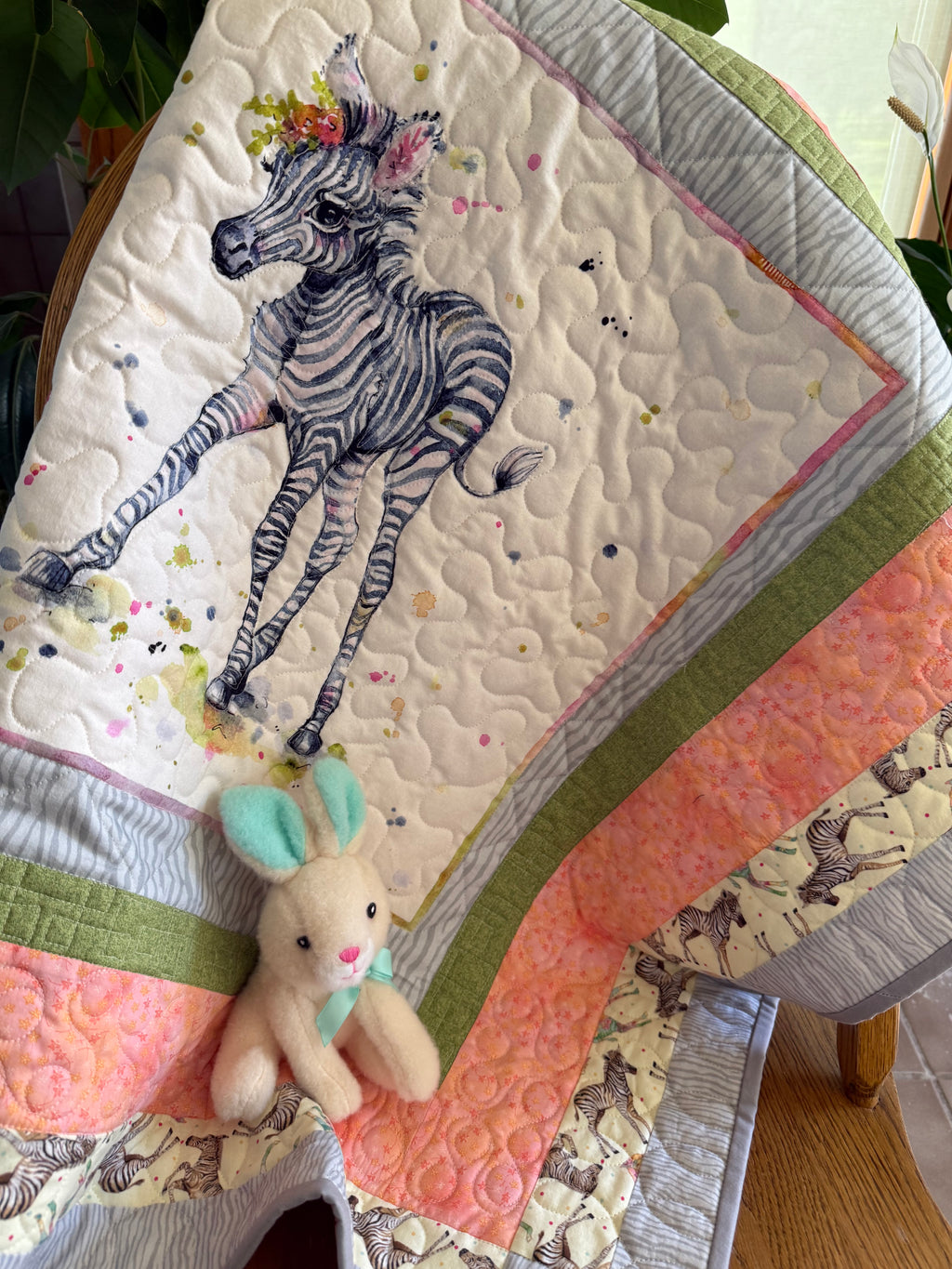 Handmade baby quilt with a cute zebra in gray and green fabrics