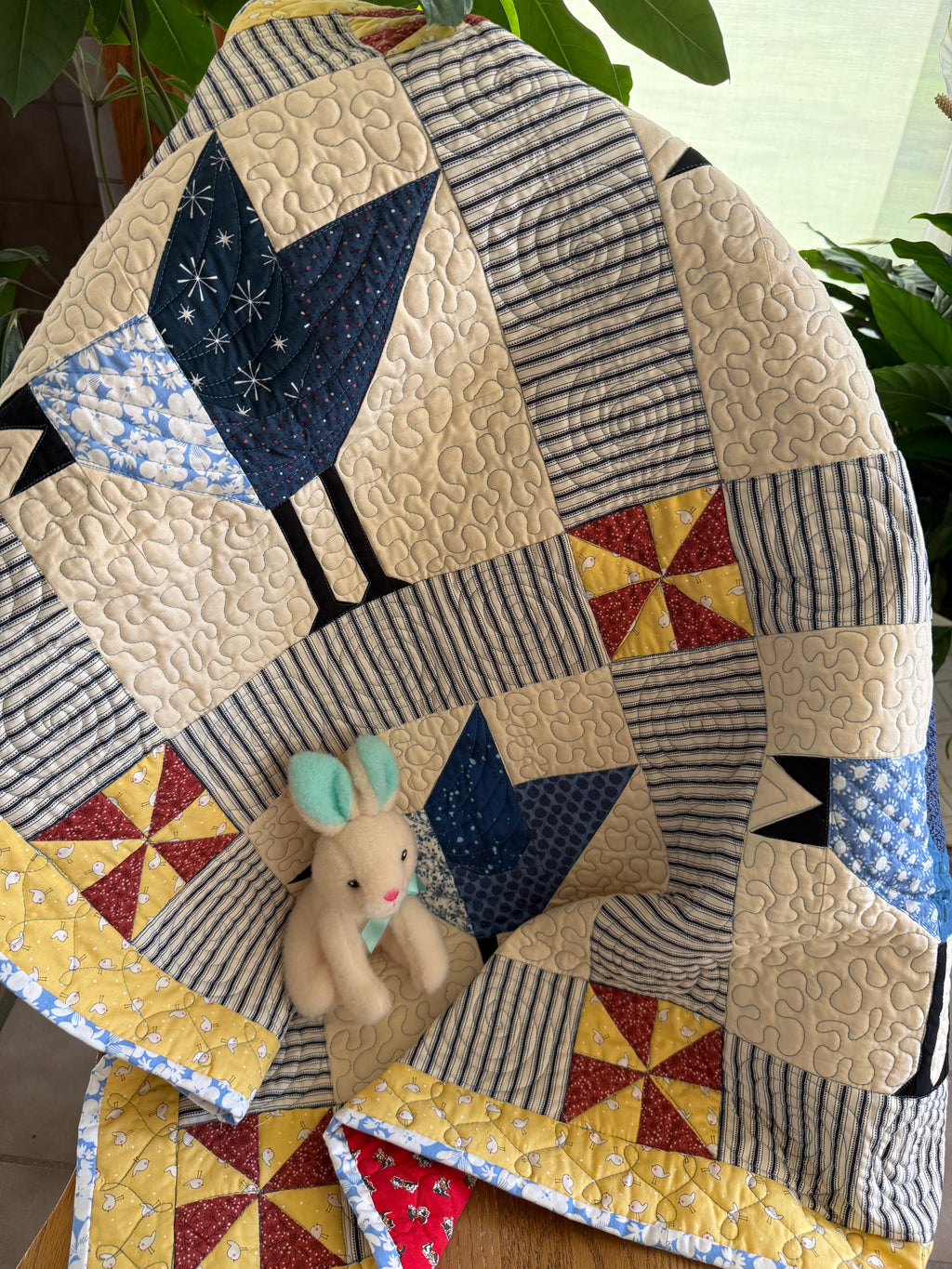 Handmade baby quilt with blue jays in vintage cotton fabrics