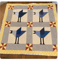 Handmade bird baby quilt with blue jays 