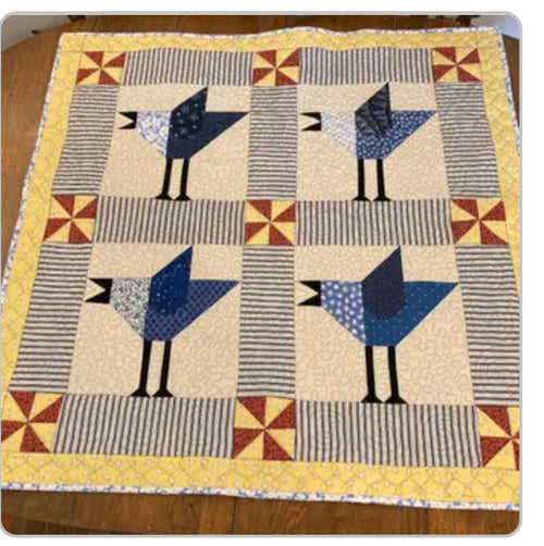 Handmade bird baby quilt with blue jays 