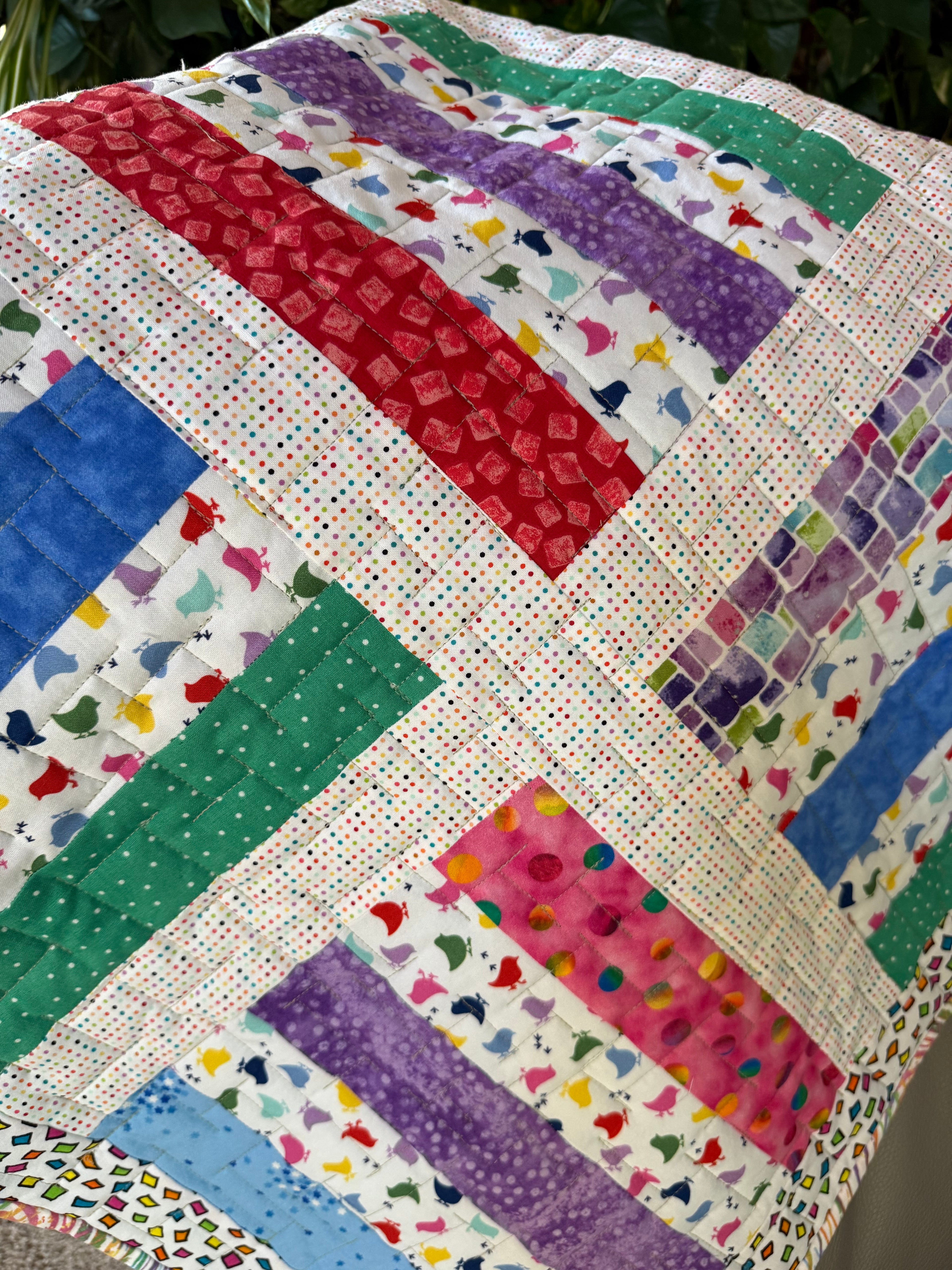 Colorful baby quilt using chicken fabric 
