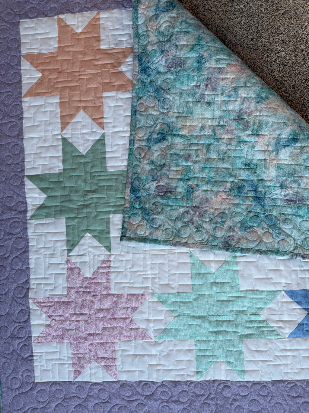 Close up of star quilt and backing fabric 