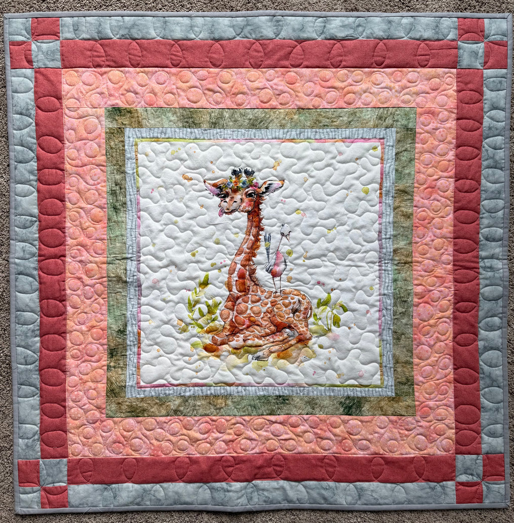 Handmade baby quilt with giraffe and orange and gray borders 