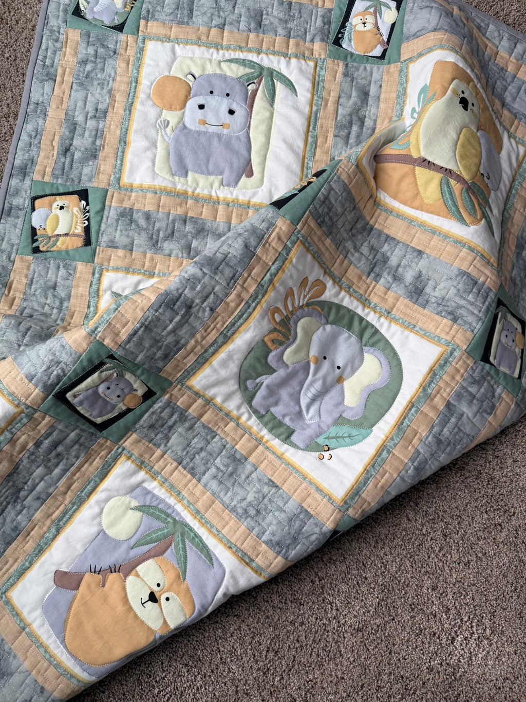 Handmade baby quilt for safari themed nursery 