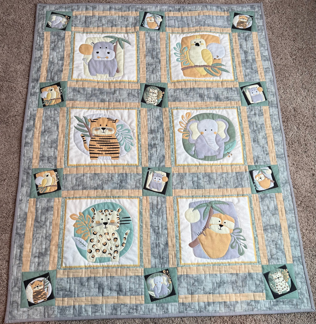 Handmade safari baby quilt in gray and green