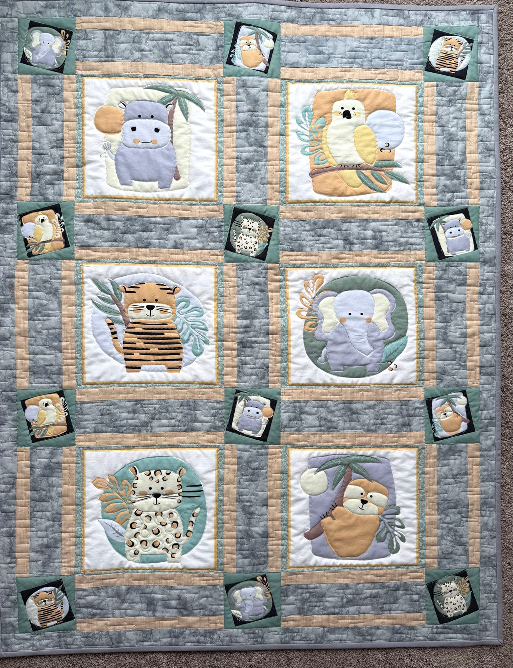 Handmade safari baby quilt with jungle animals